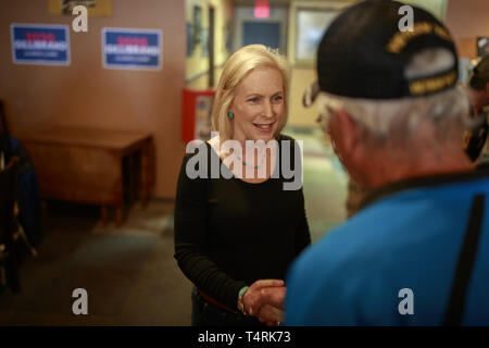 Creston, Iowa, USA. 18th Apr, 2019. New York Democratic Senator Kirsten Gillibrand campaigns for President of the United States as she shakes hands of her supporters during a ''listening tour'' stop at at the Adams Street Espresso & Soda Shoppe in Creston, Iowa. More than a dozen Democratic party candidates are campaigning in the state of Iowa to win the Iowa Democratic Caucuses February 3, 2020. Credit: ZUMA Press, Inc./Alamy Live News Stock Photo