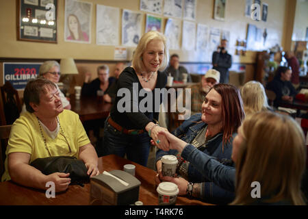 Creston, Iowa, USA. 18th Apr, 2019. New York Democratic Senator Kirsten Gillibrand campaigns for President of the United States as she shakes hands of her supporters during a ''listening tour'' stop at at the Adams Street Espresso & Soda Shoppe in Creston, Iowa. More than a dozen Democratic party candidates are campaigning in the state of Iowa to win the Iowa Democratic Caucuses February 3, 2020. Credit: ZUMA Press, Inc./Alamy Live News Stock Photo