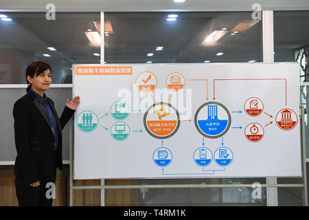(190419) -- YANGQUAN, April 19, 2019 (Xinhua) -- A staff worker introduces the working mechanism of 'Sui Shou Pai', an app that allows people to express their concerns by submiting pictures, at the Yangquan radio and television station in Yangquan, north China's Shanxi Province, April 15, 2019. Yangquan has been transforming from a coal-dependent city to a city applying new technologies of Big Data and information services to various aspects of social life and developments. From harboring Baidu's cloud computing center, to taking advantages of various apps and platforms to collect citizen's co Stock Photo