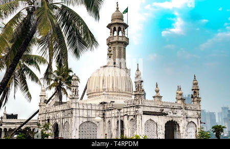 Famous Sufi Shrine Haji Ali Dargah aka Pir Haji Ali Shah Bukhari on bright day is world famous Islamic Mosque, center of attraction for Mumbai Tourism Stock Photo