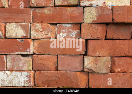 A close up of a pile pf red coloured bricks used in construction ready to use Stock Photo