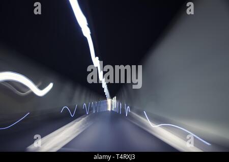 Narrow Tunnel with Light Effect in Switzerland. Stock Photo