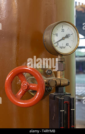 Measuring instrument on a historic generator in an old power plant in Germany Stock Photo