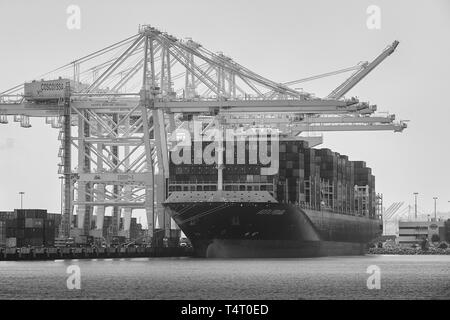 Black And White Photo Of The Giant Wan Hai Lines Container Ship, KOTA PERABU, Moored In Pier J At The Long Beach Container Terminal, California, USA. Stock Photo