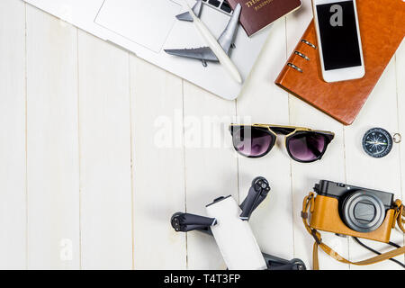 Hi Tech Travel objects and gadgets for modern traveler with white wooden copy space Stock Photo