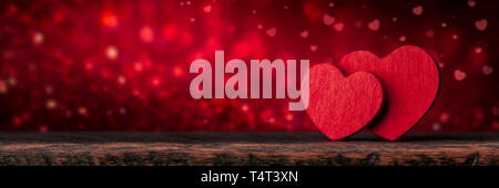 Two hearts on a glitter background. Stock Photo