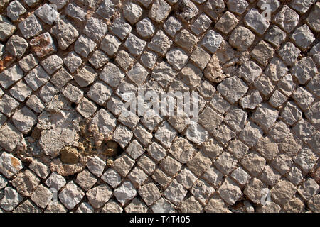 Details from a Roman wall opus reticulatum in Sperlonga, Italy, about 2000 years old, typical for ancient Roman architecture. Stock Photo