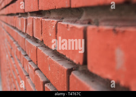 red brick wall in perspective. selective focus. Stock Photo