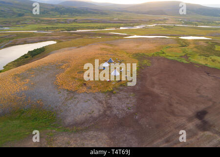 View from height on a settlement of nomads reindeer breeders in the valley of the Longotjyogan River (aerial photography). Polar Ural Mountains, Russi Stock Photo