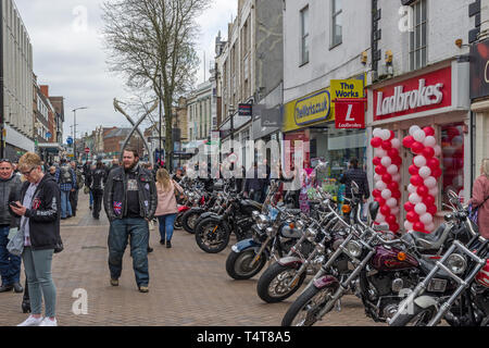 Harley Davidson motor bikes lining Abington Street in the town centre of Northampton, UK; part of an annual charity fund raiser Stock Photo