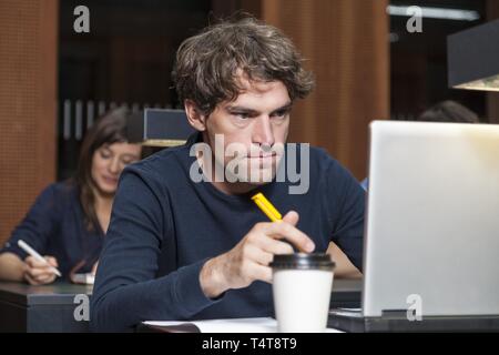 Student working on a laptop Stock Photo