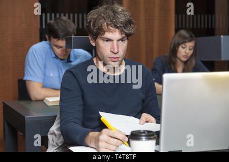 Student working on laptop Stock Photo