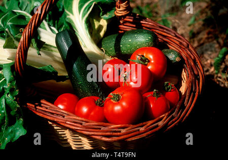 Fresh vegetables in wicker basket Stock Photo