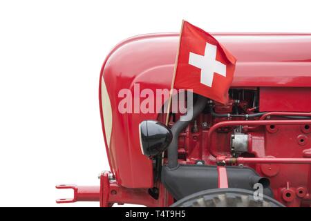 Old Tractor with Swiss Flag. Stock Photo