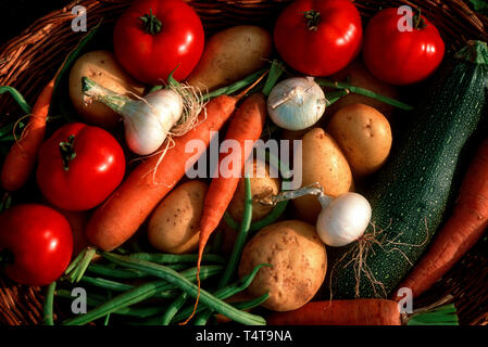 Fresh vegetables in wicker basket Stock Photo