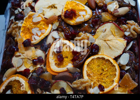Delicious fruit cake with dried baked orange apple plum slice on top Christmas traditional foo sweet dessert homemade cake beautiful decoration food Stock Photo