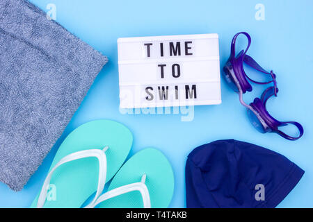 Swimming set - slippers, towel, goggles and swimming cap Stock Photo