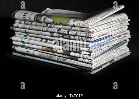 Stack of newspapers, Germany, Europe Stock Photo