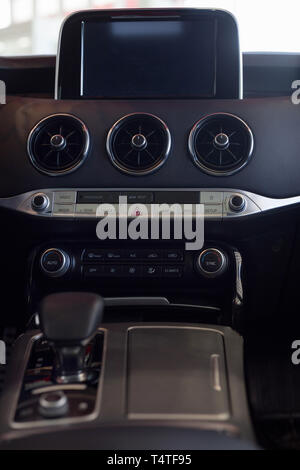 Russia, Izhevsk - April 4, 2019: Showroom KIA. Interior of new sports car Stinger. Dealer showroom. Modern and prestigious vehicles. Stock Photo