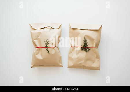 Brown rustic gift on white background. Stock Photo