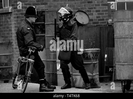 British Police armed with guns. 1986 Photographs from a series photographed in 1986 showing the arming of the British Police, traditionally at the time not armed. Gun dealer in the west country of the UK shows his weapons for sale to a real local policeman on a bicycle. Stock Photo