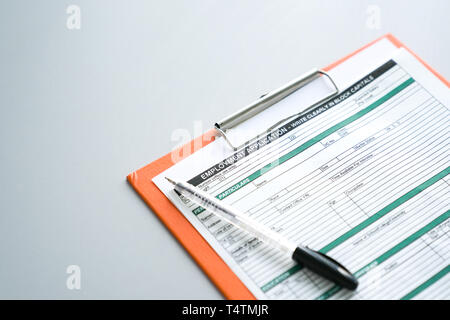 Seeking job concept, filling up the information in an employment application form Stock Photo