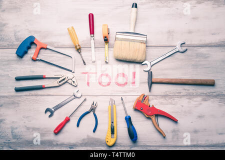Set of work tool on rustic wooden background with written "tool" in space, industry engineer tool concept.still-life.close up. Stock Photo