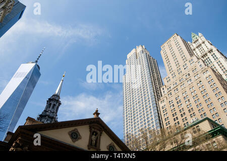 Looking up at St. Paul's Chapel Trinity Church, One World Trade, 225 Broadway and The Woolworth Building in downtown Manhattan. Stock Photo