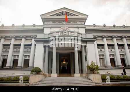 Ho Chi Minh City, Vietnam - March 11, 2019 :  Tourist at entrance to Ho Chi Minh Museum in Ho Chi Minh City, or Saigon, Vietnam. Stock Photo