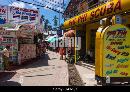 Phi Phi Island, Town center, Thailand, March 2013 Scuba Diving Center and tourist information, tourists shopping on the market street Stock Photo