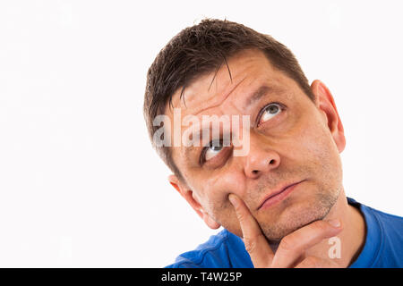 A man looks thoughtfully upwards - isolated Stock Photo