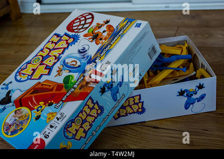 Close up or Hasbro Mousetrap game all boxed up on a wooden floor ready to be played and enjoyed. Mousetrap has been around since 1962, and whilst it h Stock Photo