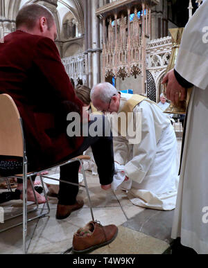 The Archbishop of Canterbury Justin Welby performs the Washing of The Feet ceremony during the Maundy Thursday service at Canterbury Cathedral in Kent. Stock Photo