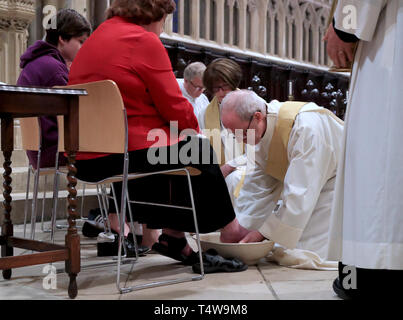 The Archbishop of Canterbury Justin Welby performs the Washing of The Feet ceremony during the Maundy Thursday service at Canterbury Cathedral in Kent. Stock Photo