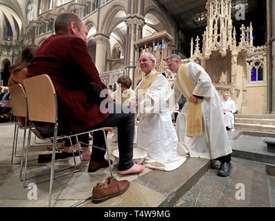 The Archbishop of Canterbury Justin Welby performs the Washing of The Feet ceremony during the Maundy Thursday service at Canterbury Cathedral in Kent. Stock Photo