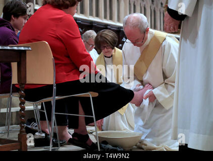 The Archbishop of Canterbury Justin Welby performs the Washing of The Feet ceremony during the Maundy Thursday service at Canterbury Cathedral in Kent. Stock Photo