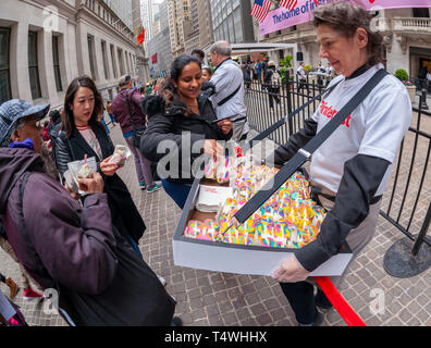 Rainbow bagels and other treats are distributed outside the New York Stock Exchange in celebration of the first day of trading for Pinterest's initial public offering (IPO) in Lower Manhattan in New York on Thursday, April 18, 2019. The social media giant priced its shares at $19 making the company worth over $10 billion, well into the 'unicorn' range.  (Â© Richard B. Levine) Stock Photo