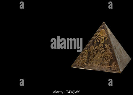 Figurine of egyptian pyramid with copy space background Stock Photo