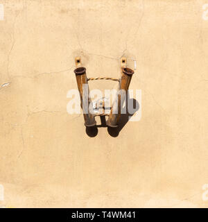 Old rusty flag holder on wall Stock Photo