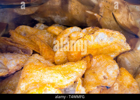 Inside the potato chips bag. Opened pack of original taste delicious potato crisps. Fast food and unhealthy eating concept Stock Photo