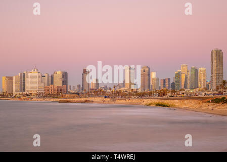 skyline of Tel Aviv, Israel by the beach at dusk Stock Photo