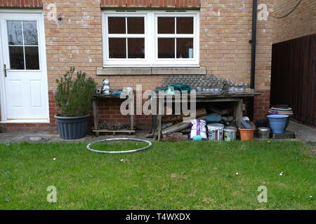 Garden bench in back garden in Glasgow Stock Photo