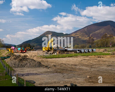 Water pipes and construction equipment near Keswick servicing the West Cumbria Water Supplies project Stock Photo