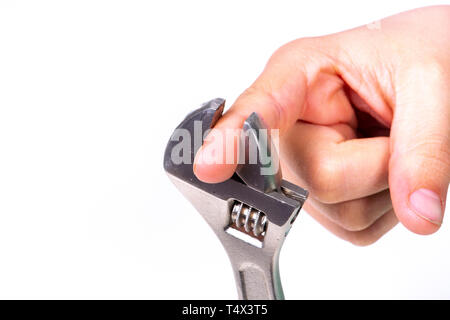 Boy clamps his finger in a pair of pliers called french pliers. Stock Photo