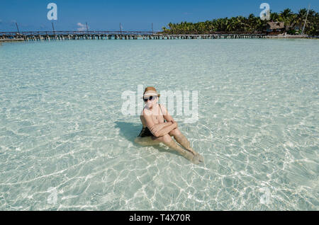 Woman relaxing in the beach of Punta Norte, Isla Mujeres Stock Photo