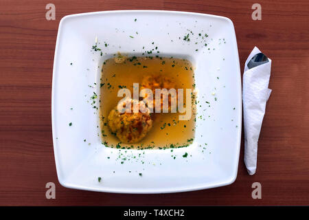 Soup with cheese and bread dumplings, a west austrian specialty Stock Photo