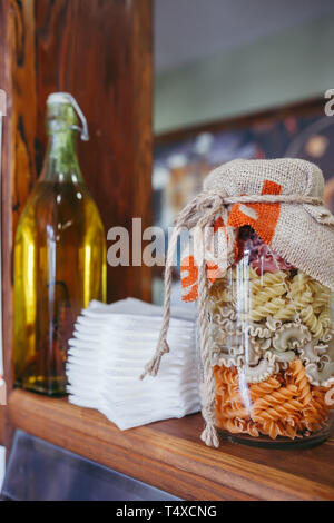 Cereal pots and breakfast bowls in a hotel on wooden board Stock Photo