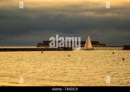 Cherbourg-Octeville, France - August 21, 2018: Sailboat in the harbor of Cherbourg during sunset. Normandy, France Stock Photo