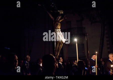 Worshippers  carry a sculpture of Jesus Christ as take part at the procession of Silence for Maundy Thursday in Badalona during the Holy Week. The pro Stock Photo