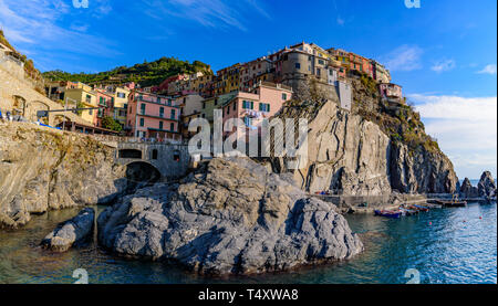 Panoramic view of Manarola, one of the five Mediterranean villages in Cinque Terre, Italy, famous for its colorful houses and harbor Stock Photo
